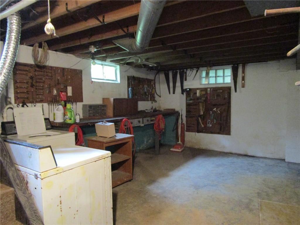 26071 State Rte 27 Guys Mills, PA 16327 - Photo 11 of 16 a living room with furniture and a fireplace