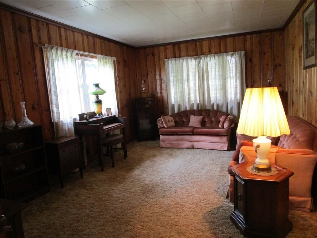 26071 State Rte 27 Guys Mills, PA 16327 - Photo 3 of 16 a living room with furniture and a lamp