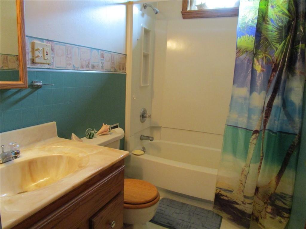 26071 State Rte 27 Guys Mills, PA 16327 - Photo 6 of 16 a bathroom with a sink and toilet