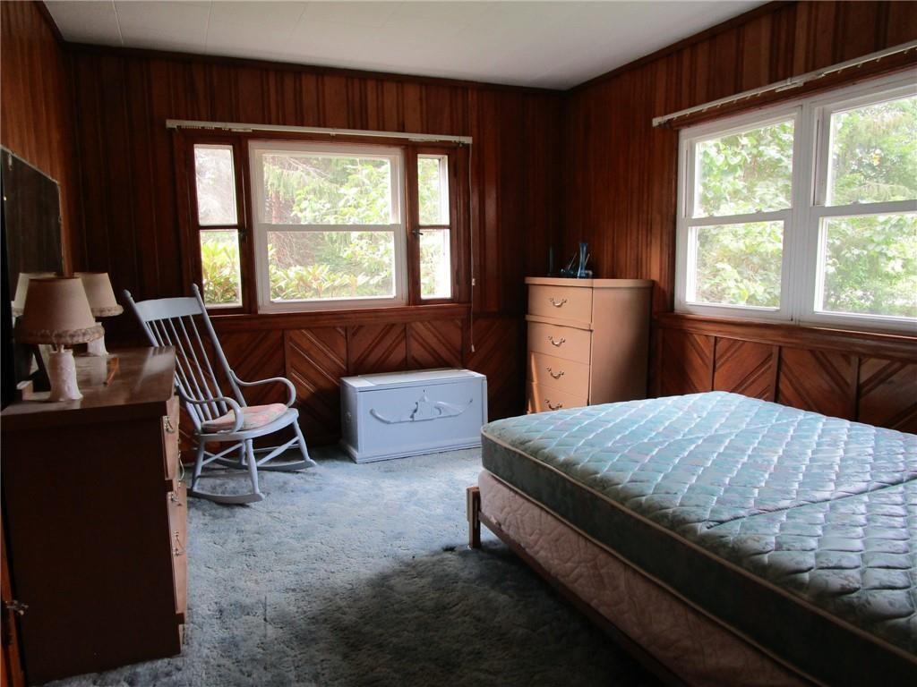 26071 State Rte 27 Guys Mills, PA 16327 - Photo 8 of 16 a bed room with a bed and a chair