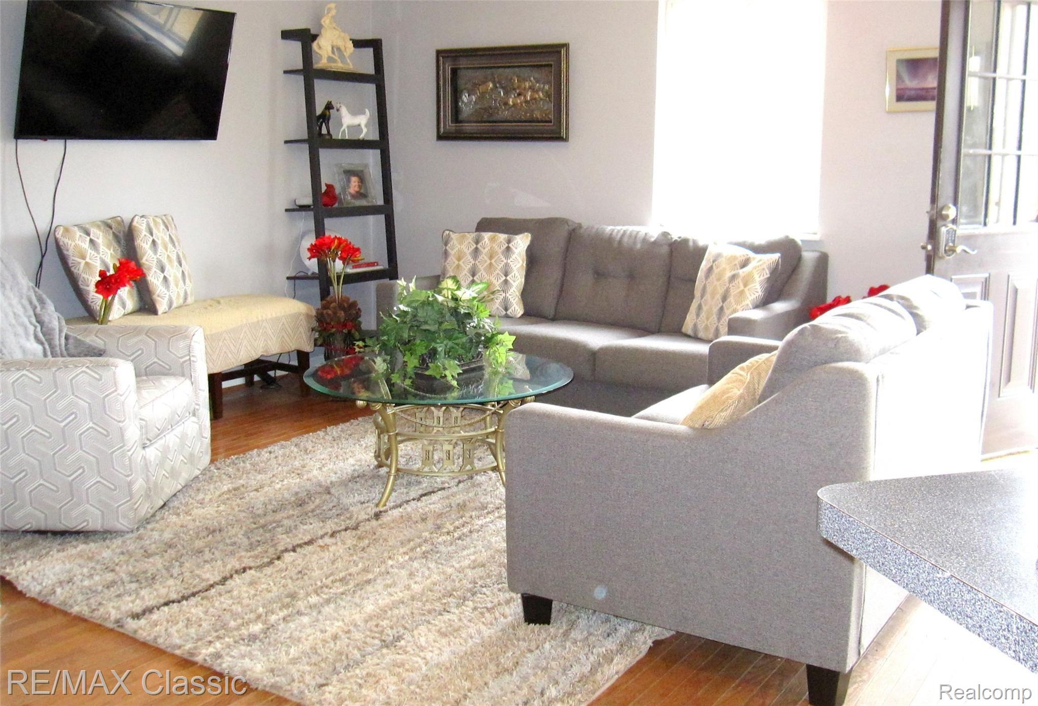 8650 North Rushton Road South Lyon, MI 48178 - Photo 9 of 17 Great Room with Hardwood Flooring.JPG