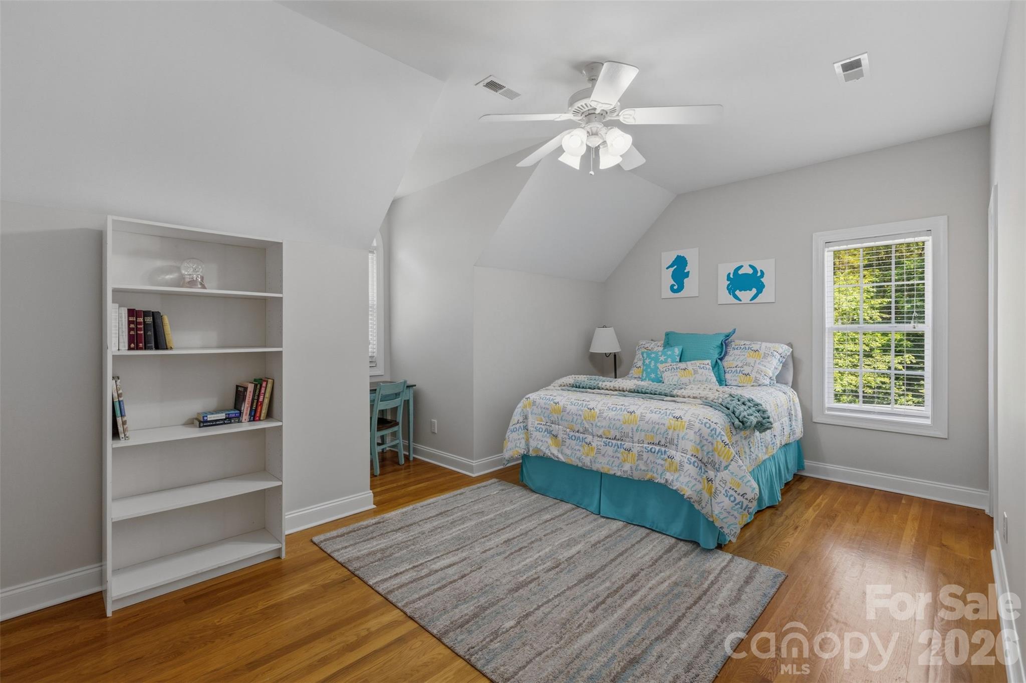 710 Sleepy Hollow Road Midland, NC 28107 - Photo 18 of 29 a bedroom with a bed and wooden floor