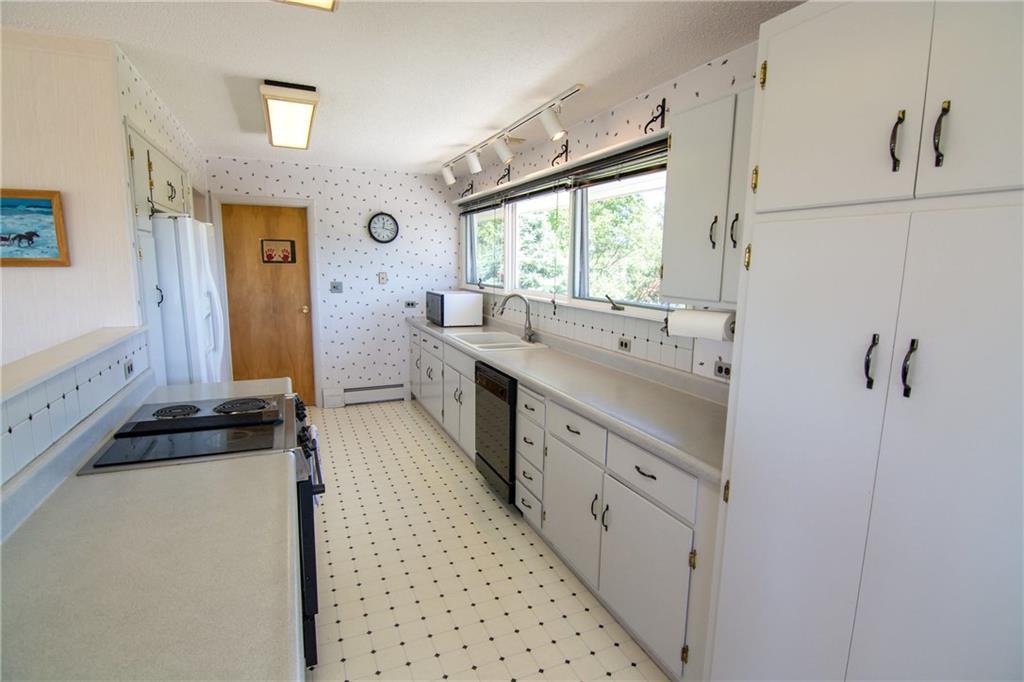 325 Ficketts Point Road Milbridge, ME 04658 - Photo 18 of 35 Kitchen looking to laundry room and...