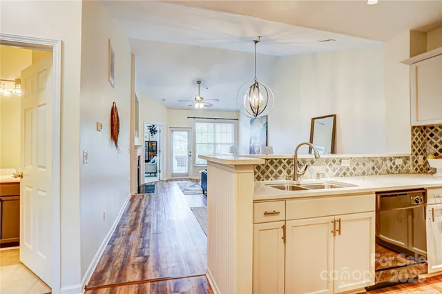 a view of a kitchen from the hallway