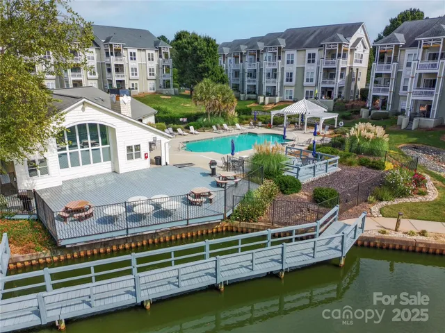 a view of multiple houses with a lake view