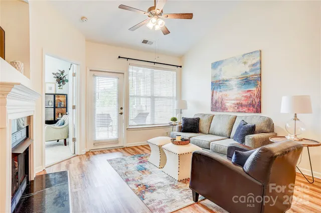 a living room with furniture and a fireplace