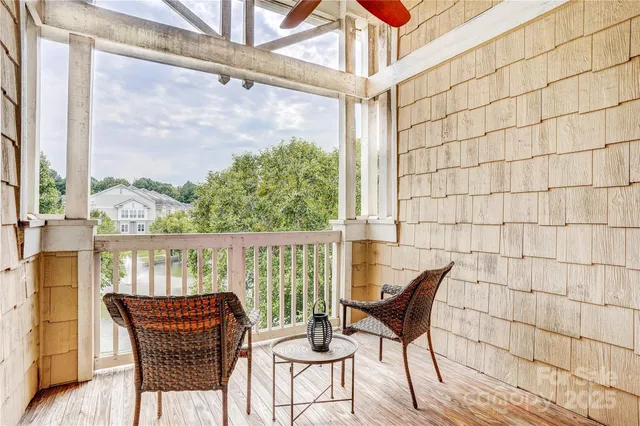 a view of a chairs and table in the balcony