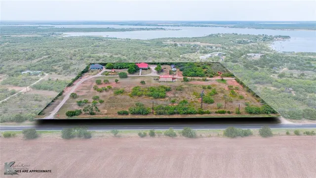 a view of swimming pool with a back yard