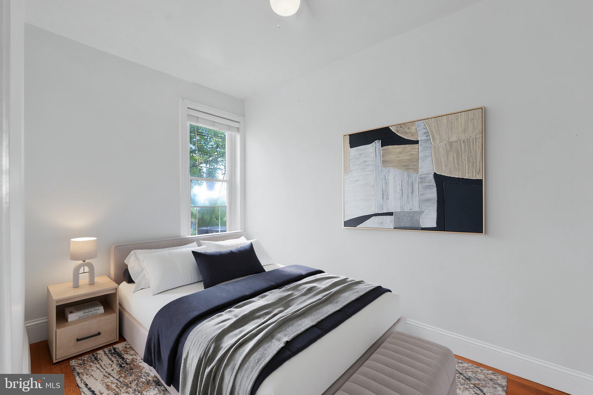 890 North Stillman Street Philadelphia, PA 19130 - Photo 14 of 28 Serene bedroom with modern art.