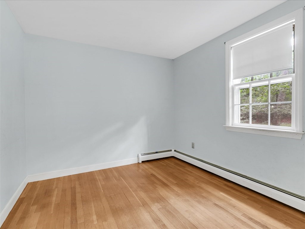 70 Parsonage Lane Topsfield, MA 01983 - Photo 11 of 29 a view of a room with a wooden floor and a window