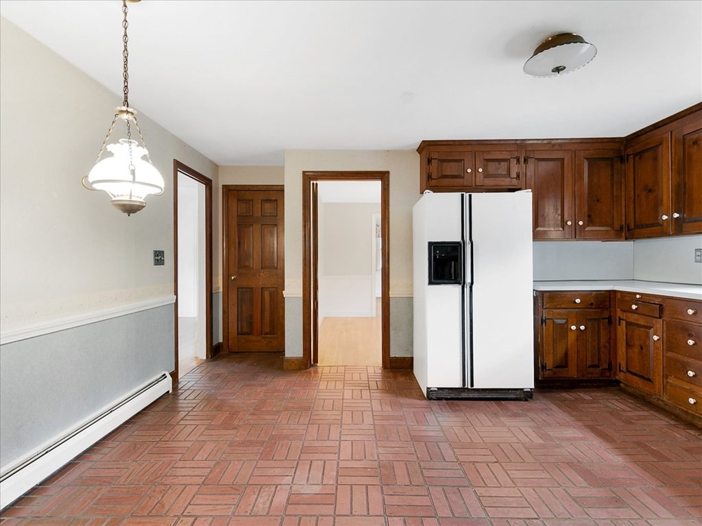 70 Parsonage Lane Topsfield, MA 01983 - Photo 14 of 29 a view of a kitchen with a sink and dishwasher wooden floor