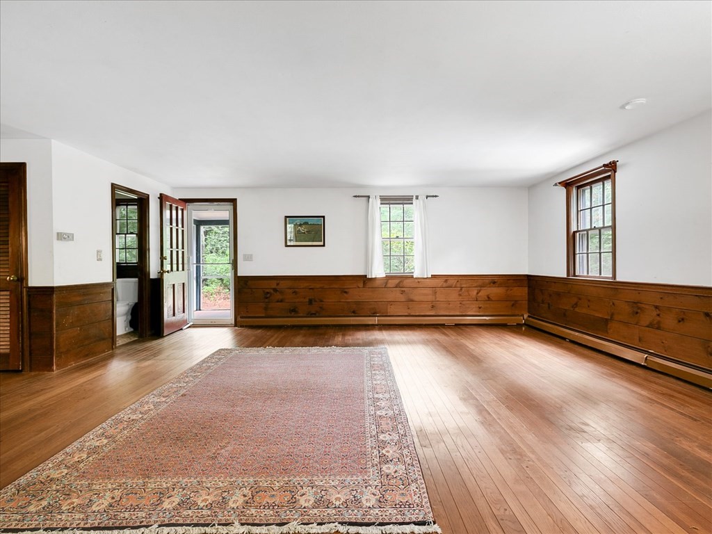 70 Parsonage Lane Topsfield, MA 01983 - Photo 17 of 29 a view of a room with wooden floor and cabinet