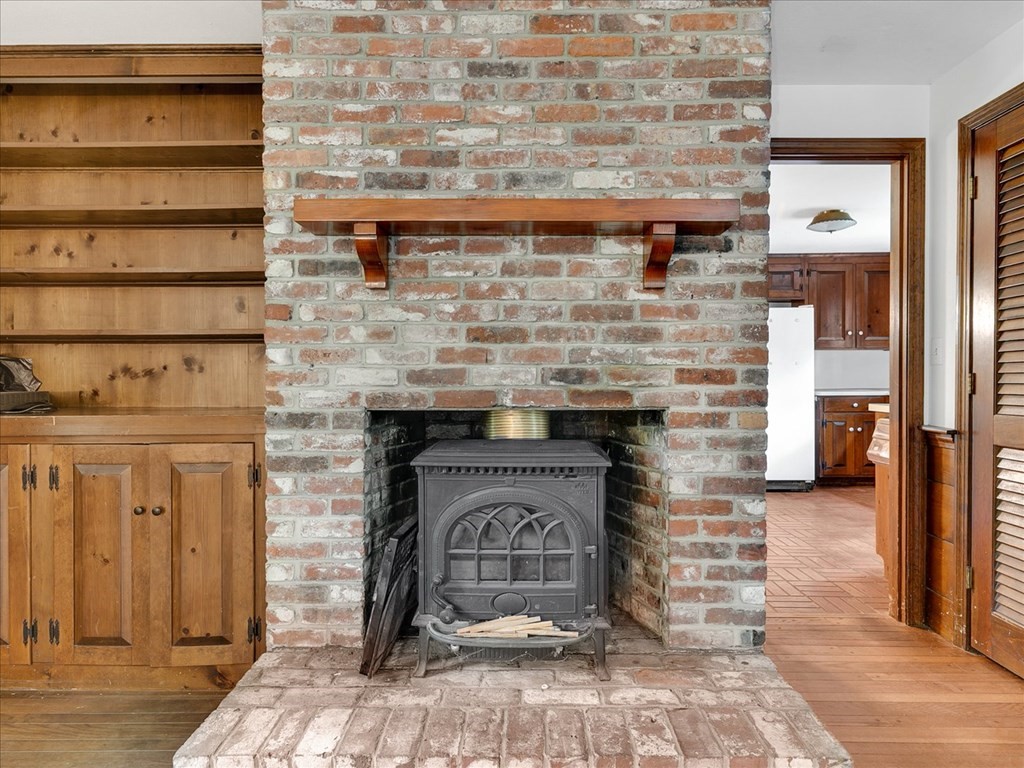 70 Parsonage Lane Topsfield, MA 01983 - Photo 18 of 29 a stone fireplace with a sink