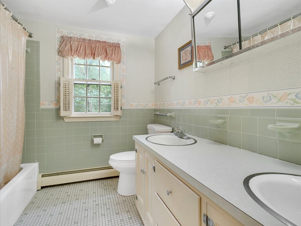 70 Parsonage Lane Topsfield, MA 01983 - Photo 23 of 29 a bathroom with a granite countertop toilet sink and mirror