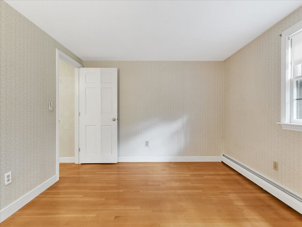 70 Parsonage Lane Topsfield, MA 01983 - Photo 29 of 29 a view of an empty room with wooden floor and a window