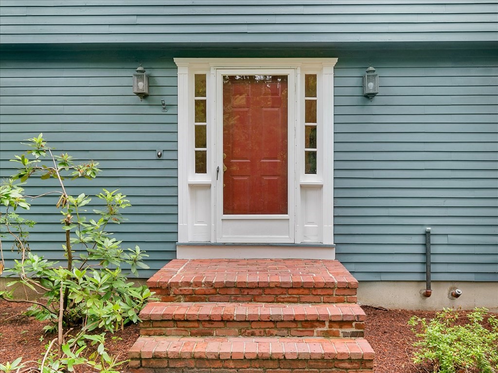 70 Parsonage Lane Topsfield, MA 01983 - Photo 6 of 29 a front view of a house with plants