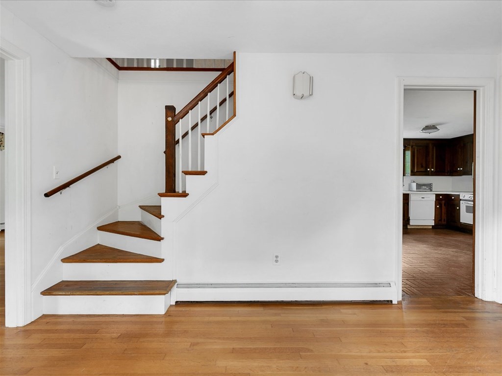 70 Parsonage Lane Topsfield, MA 01983 - Photo 8 of 29 a view of entryway and hall with wooden floor