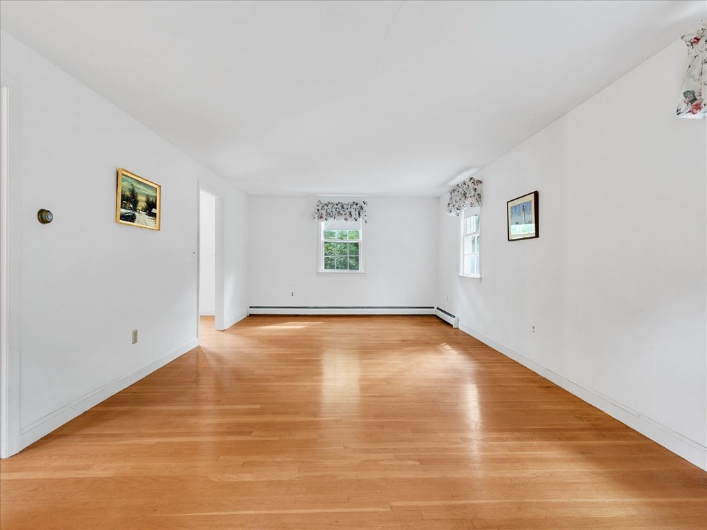 70 Parsonage Lane Topsfield, MA 01983 - Photo 10 of 29 a view of empty room with wooden floor