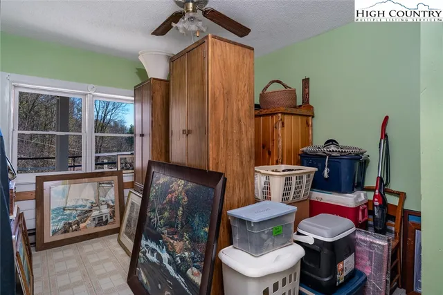 a bathroom with a toilet a sink and a mirror