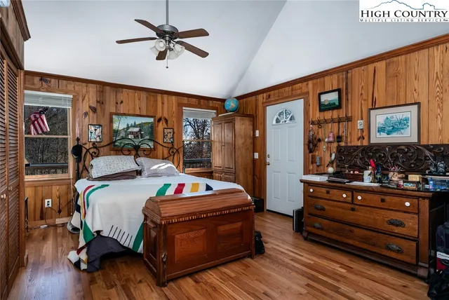 a bed room with bed and wooden floor