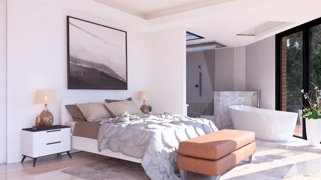 a bedroom with a bed and glass walk in closet