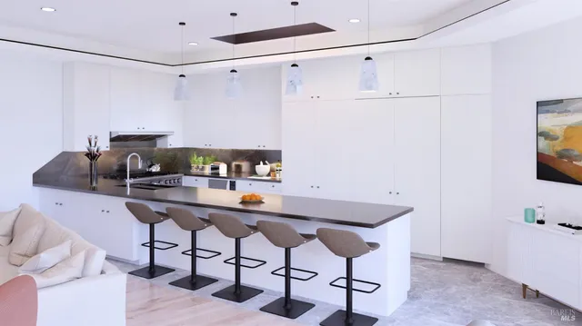 a kitchen with a table and chairs in it