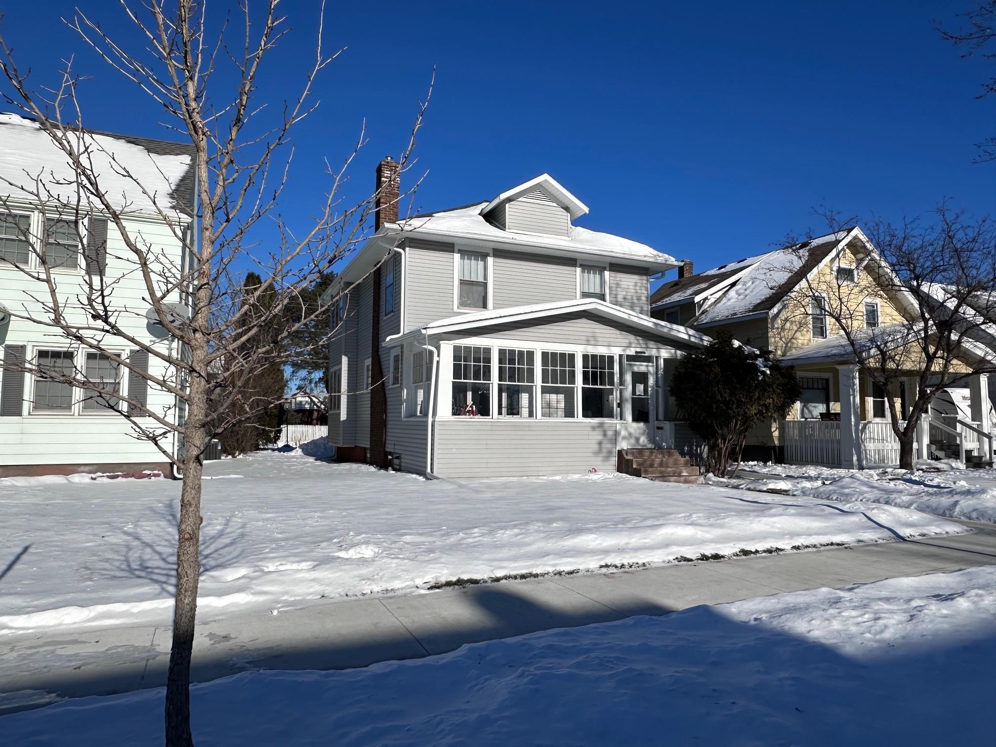 Traditional style home featuring a chimney