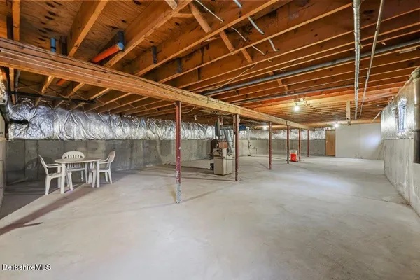 a view of empty room with wooden ceiling