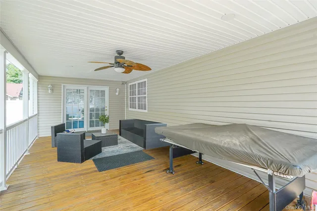 a living room with furniture and windows