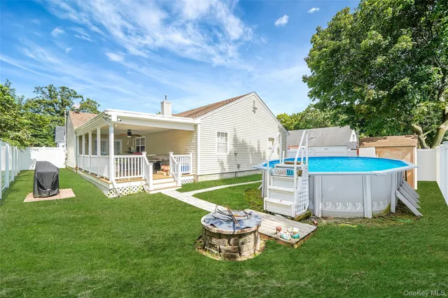 a house view with a sitting space and garden