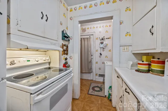 a utility room with sink dryer and washer