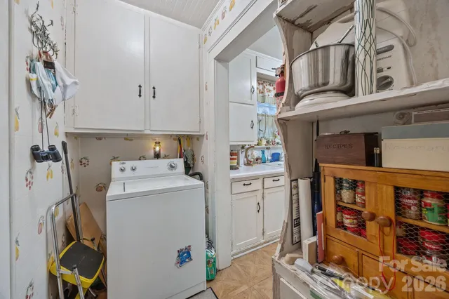 a kitchen with stainless steel appliances a refrigerator a sink and dishwasher