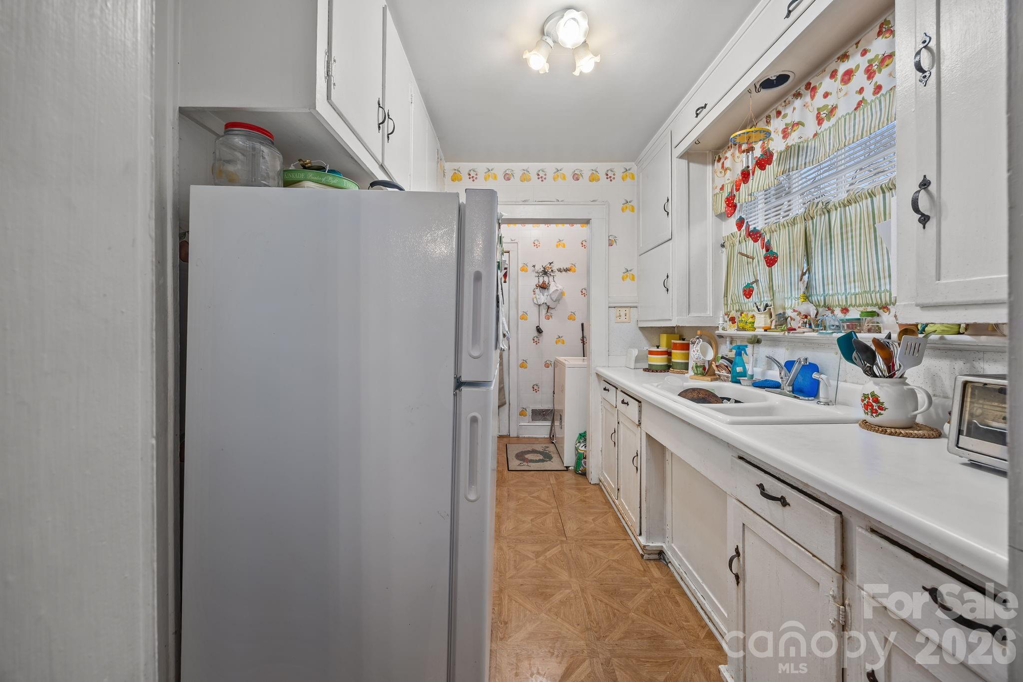 420 Spring Street Albemarle, NC 28001 - Photo 22 of 40 a kitchen with stainless steel appliances a refrigerator a sink and dishwasher