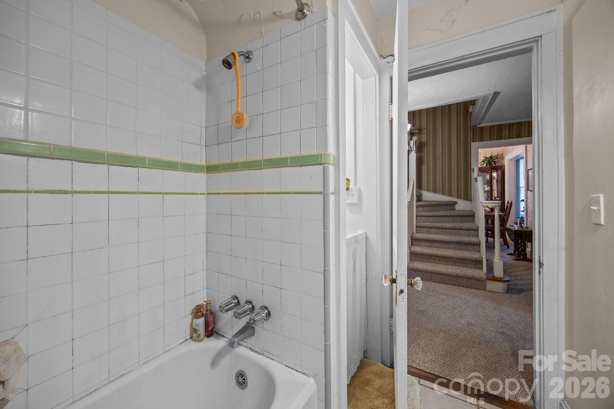 420 Spring Street Albemarle, NC 28001 - Photo 27 of 40 a bathroom with a bathtub and shower