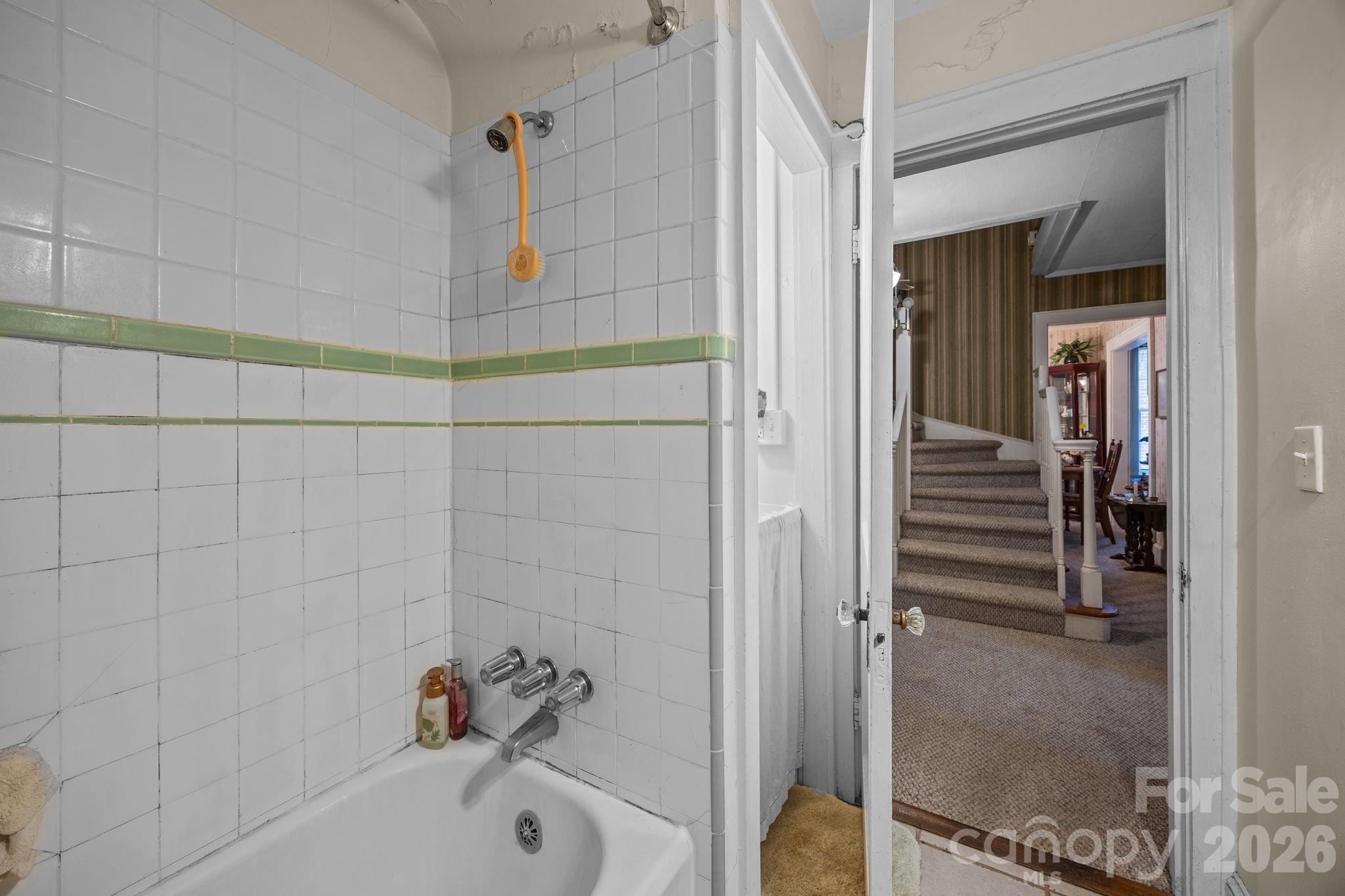 420 Spring Street Albemarle, NC 28001 - Photo 28 of 40 a bathroom with a bathtub and shower