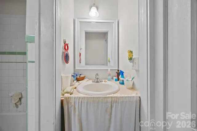 a bathroom with a bathtub and shower