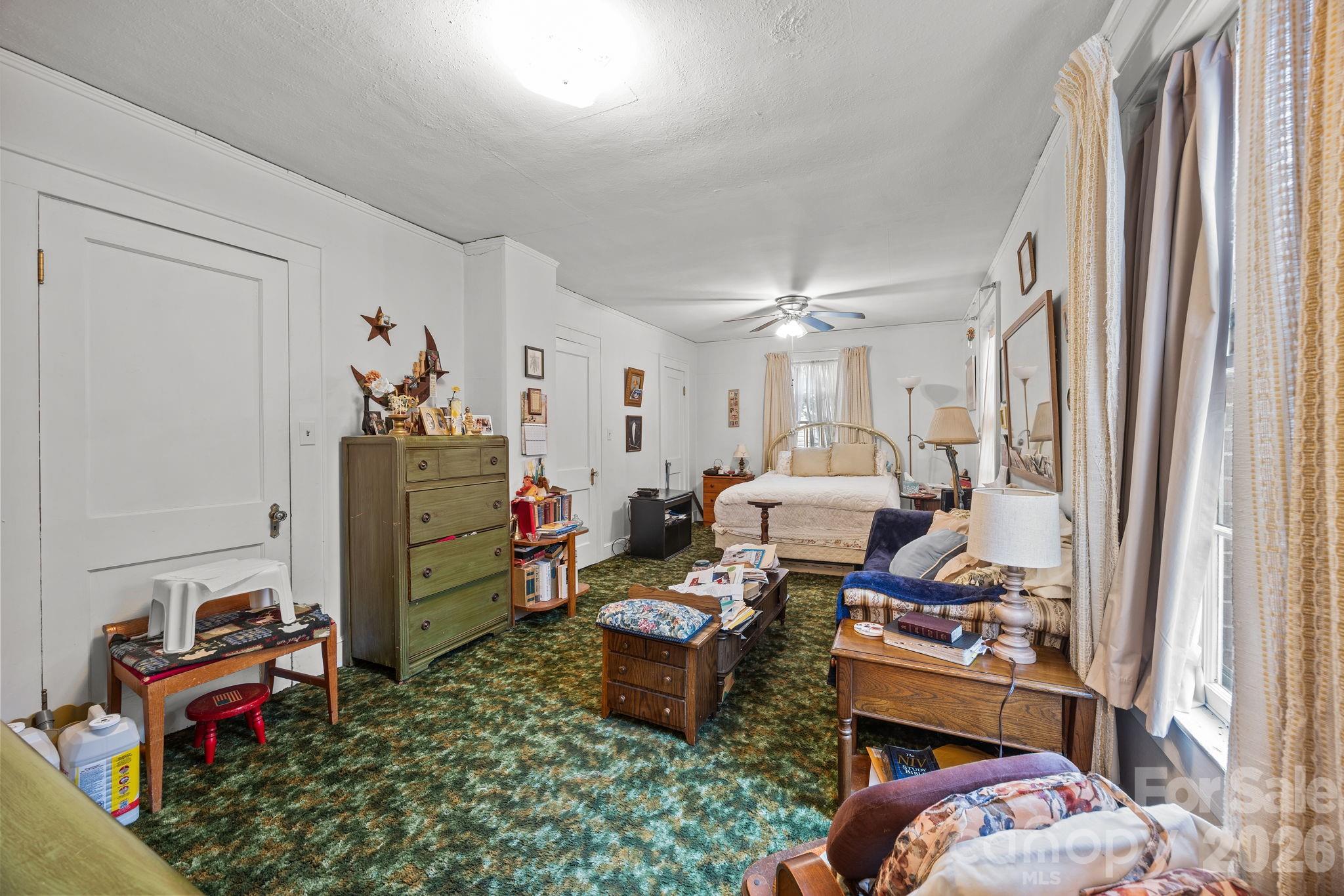 420 Spring Street Albemarle, NC 28001 - Photo 33 of 40 a room with furniture a rug toys and a window