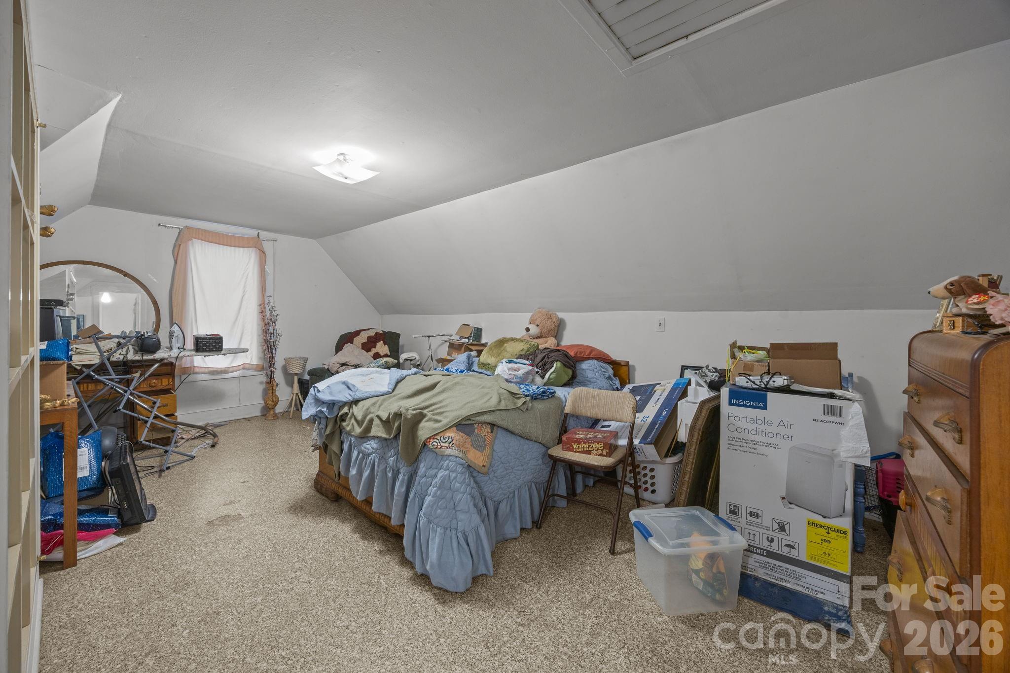 420 Spring Street Albemarle, NC 28001 - Photo 35 of 40 a bed room with a bed and a tv