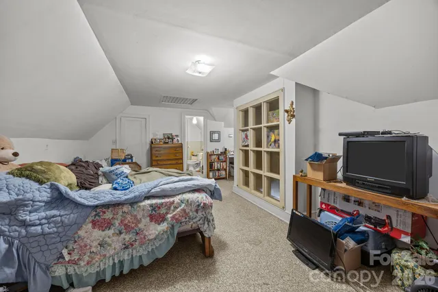 a bathroom with a tub a toilet and a shower