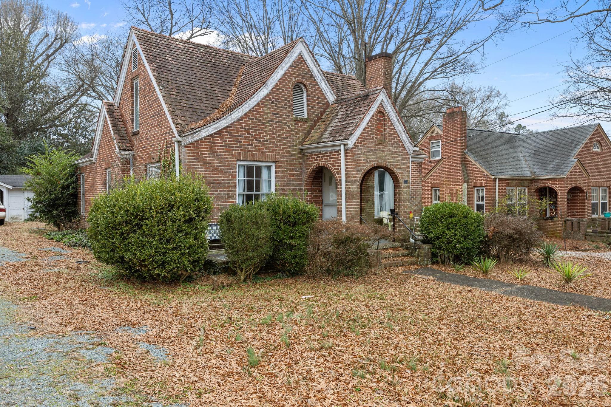 420 Spring Street Albemarle, NC 28001 - Photo 4 of 40 a front view of a house with garden