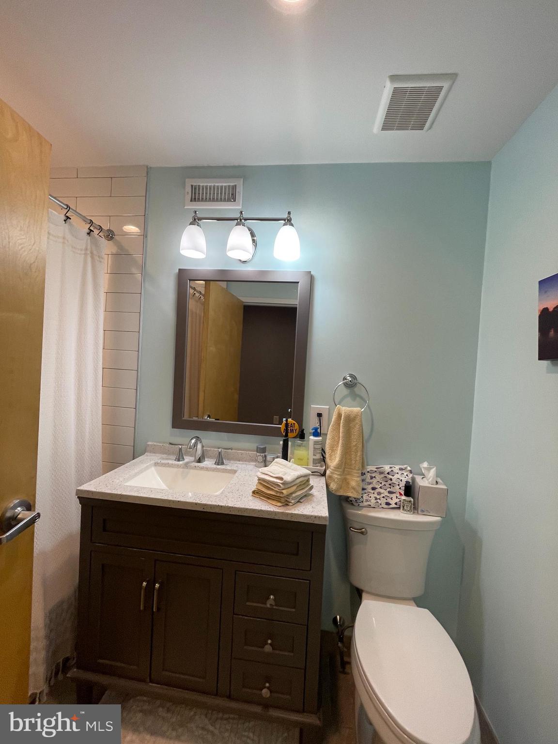 2016 Locust Street Philadelphia, PA 19103 - Photo 11 of 14 a bathroom with a toilet sink and mirror
