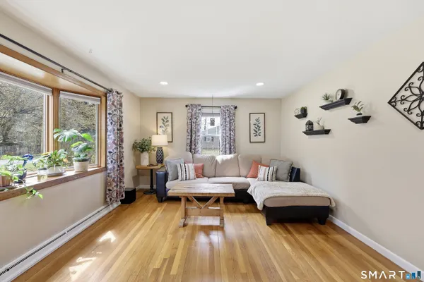 a living room with furniture and a large window