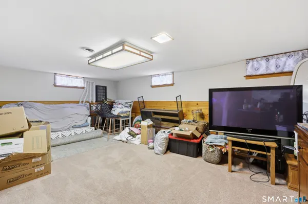 a room with furniture and a flat screen tv