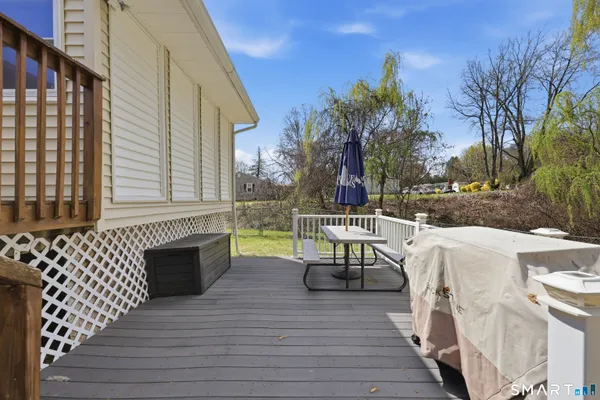 a view of roof deck with furniture