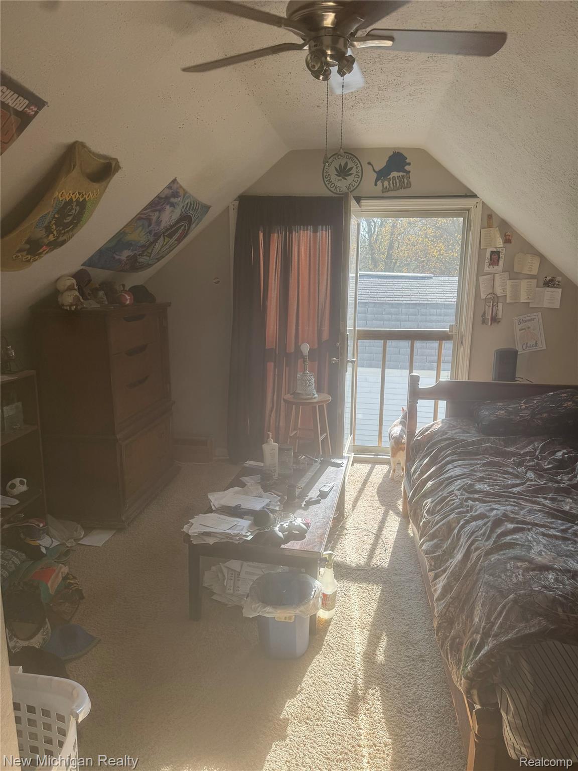 305 East Rolfe Street Perry, MI 48872 - Photo 13 of 19 Bedroom featuring a textured ceiling, access to outside, light colored carpet, and a ceiling fan
