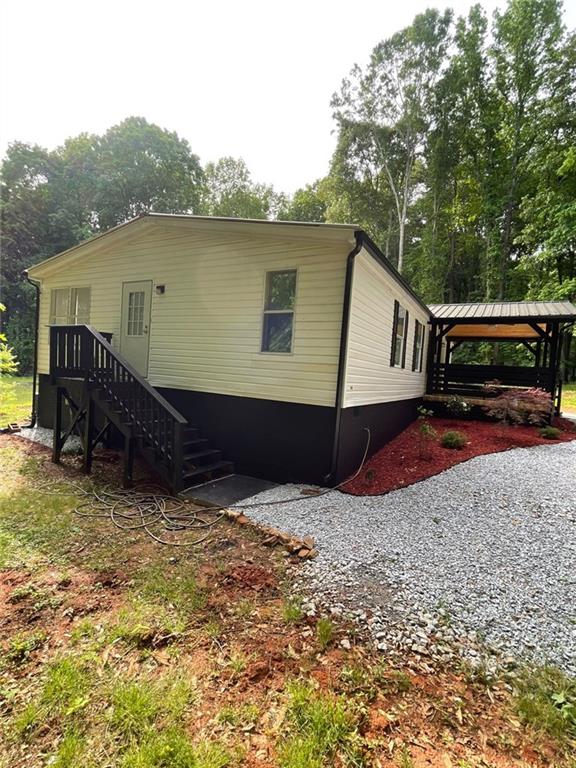 906 Jefferson River Road Jefferson, GA 30549 - Photo 15 of 25 a view of a house with a yard