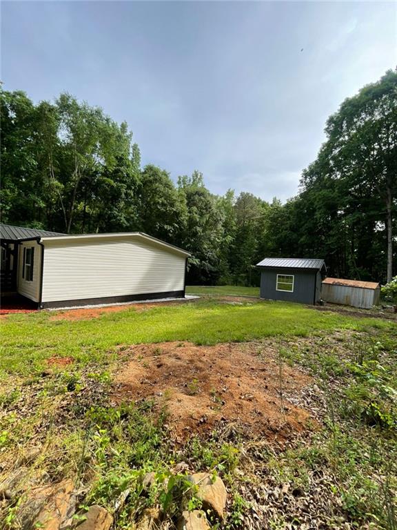 906 Jefferson River Road Jefferson, GA 30549 - Photo 18 of 25 a view of a house with a yard