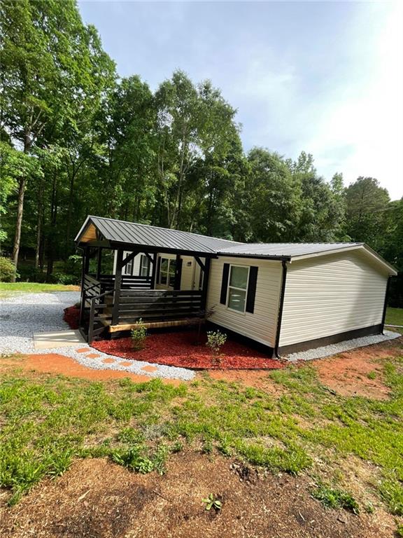 906 Jefferson River Road Jefferson, GA 30549 - Photo 24 of 25 a view of yard with swimming pool and trees