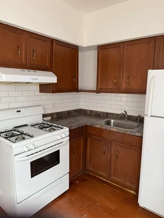 a kitchen with a stove and a sink