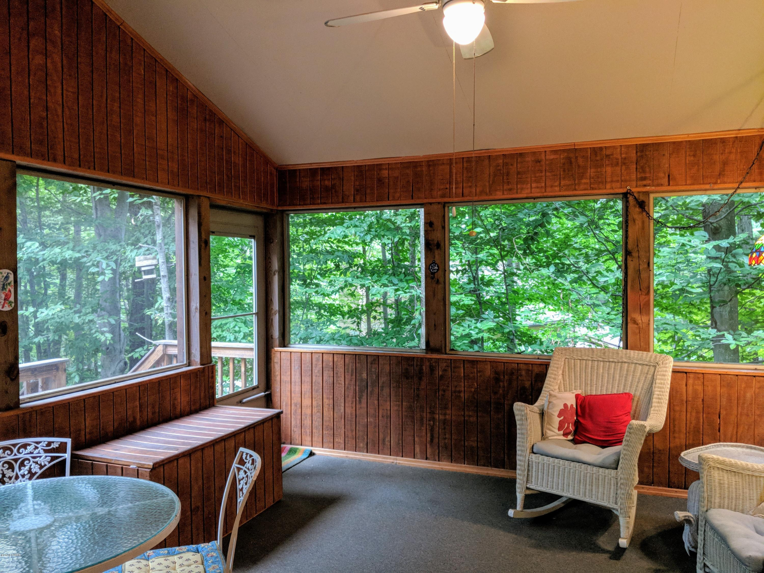 2653 Boulder Road Lake Ariel, PA 18436 - Photo 12 of 45 a living room with furniture and a floor to ceiling window